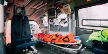 an ambulance with a stretcher attached to the back of it