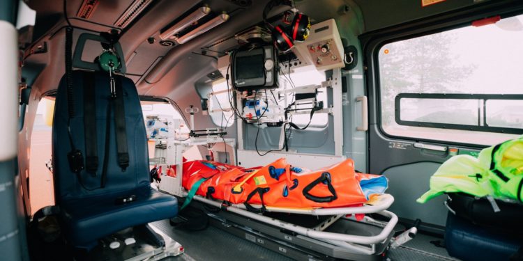 an ambulance with a stretcher attached to the back of it